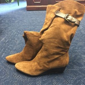 Brown Nine West wedged boots.